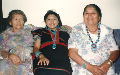 Monica with her maternal and paternal grandmothers at her college graduation in 1996.