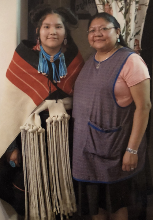Monica and her goddaughter at her corn-grinding ceremony.